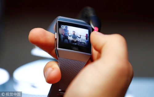 A visitor uses a Fitbit Ionic watch at the IFA Electronics Show in Berlin, Germany, Sep
